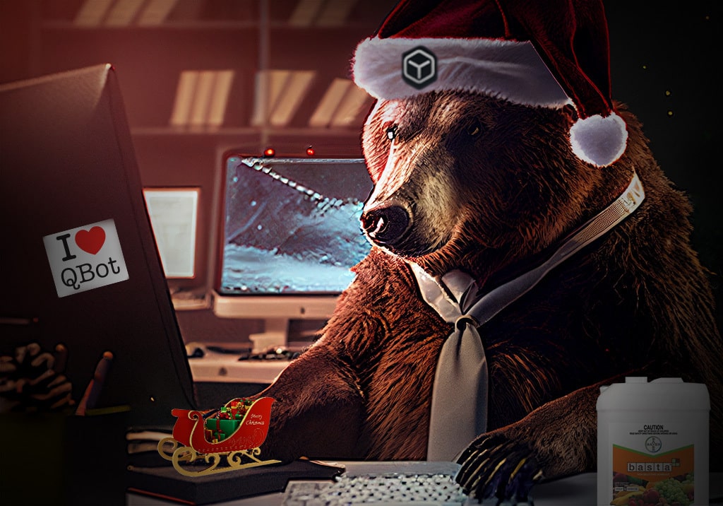 Bear in a santa hat sitting at a computer desk