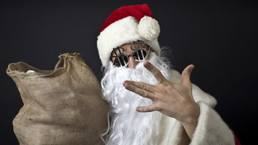 Santa wearing dollar sign glasses
